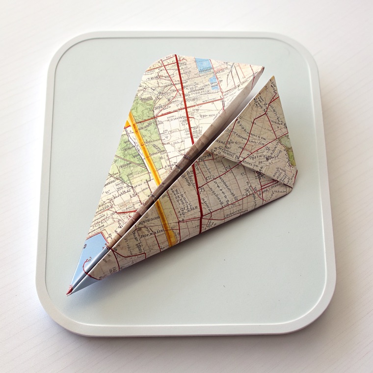 app icon, paper plane folded from a map, rounded square, gradient